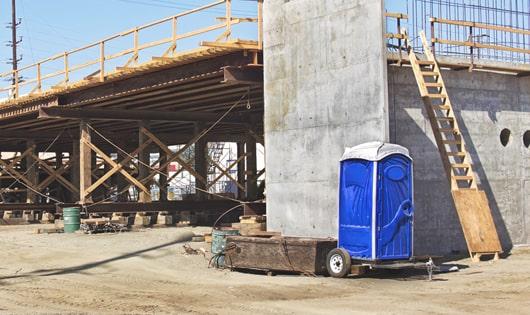 a necessary and important addition to any construction site - porta potties for workers' comfort